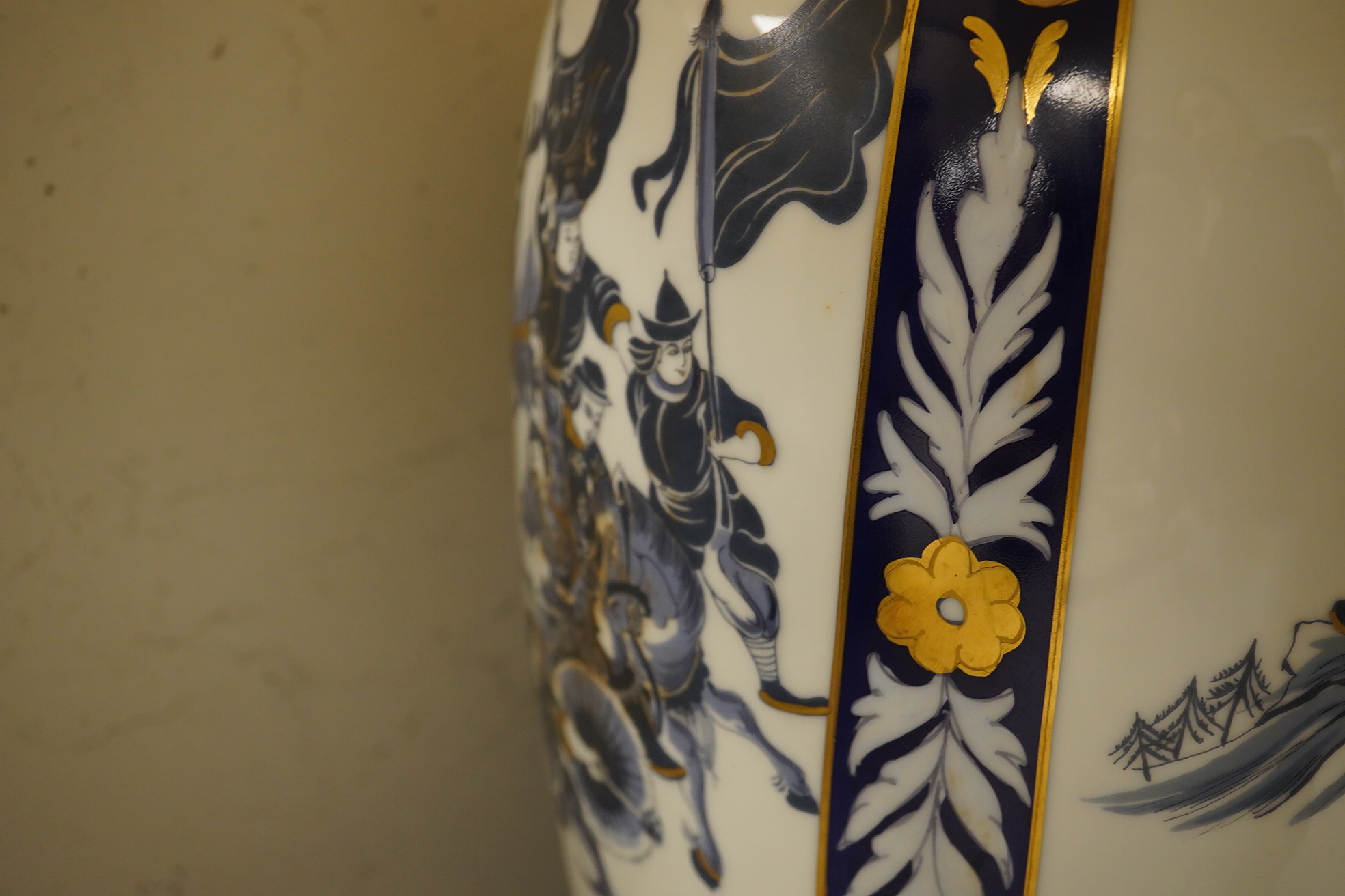 A Chinese decorated warrior porcelain vase, converted to a table lamp with cream shade, 89cm high including shade. Condition - good